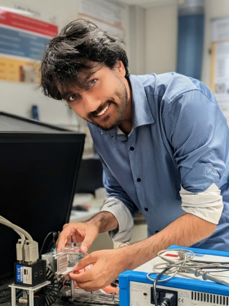 Shahariar Ryehan working with a laser vibrometer setup at Hahn-Schickard